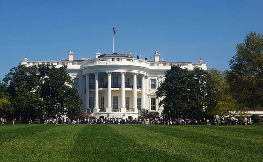 People visit the south lawn during the annual White House Spring Garden tours in Washington, April 17, 2016. The U.S. Secret Service says a person is under arrest after climbing a fence and getting onto the south grounds of the White House. The breach happened at about 11:38 p.m. Friday, March 10, 2017.  President Donald Trump was at the White House.  (AP Photo/Estelle Doro) ** FILE **
