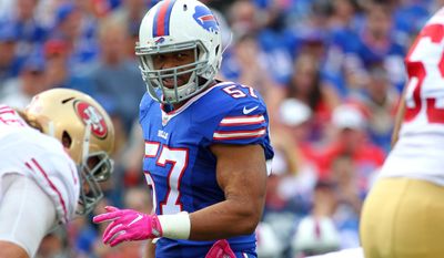 FILE - In this Oct. 16, 2016 file photo, Buffalo Bills outside linebacker Lorenzo Alexander (57) lines up against the San Francisco 49ers during the first half of an NFL football game in Orchard Park, N.Y. The Bills have agreed to re-sign Alexander, their top pass-rusher, to a two-year, $9 million contract. That&#39;s a considerable increase in pay for the 33-year-old Alexander, who was supposed to play a backup and special teams role in signing a one-year $885,000 deal with the Bills last spring. (AP Photo/Bill Wippert, File)