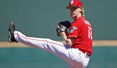 Cincinnati Reds starting pitcher Bronson Arroyo warms up prior to a spring training baseball game against the Milwaukee Brewers, Sunday, March 12, 2017, in Goodyear, Ariz. (AP Photo/Ross D. Franklin)