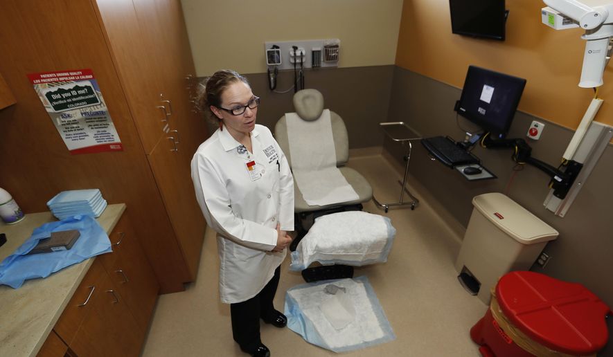 In this Thursday, March 9, 2017, photograph, Dr. Lindsey Fish waits for a patient in a procedure room in Denver Health Medical Center's primary care clinic located in a low-income neighborhood in southwest Denver. Under the new GOP health care proposal, which could roll back Medicaid expansion and take away subsidies to help pay for insurance, Denver Health could absorb a revenue loss, a problem that it will share with large public health systems across the country that serve low-income patients. (AP Photo/David Zalubowski)