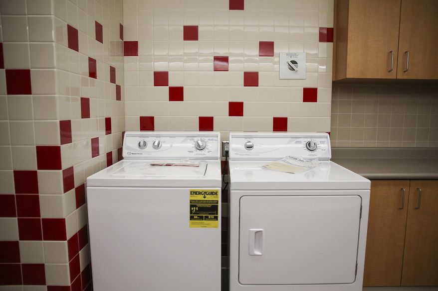 ADVANCE FOR USE SUNDAY, MARCH 12, 2017, AND THEREAFTER- In this March 10, 2017, photo, a wash rooms is shown at East High School in Salt Lake City. The school is transforming two small locker rooms into laundry/shower rooms for the school's homeless students in hopes of helping them with basic necessities so they can focus on learning, KSL-Radio reported. (Spenser Heaps/The Deseret News via AP)