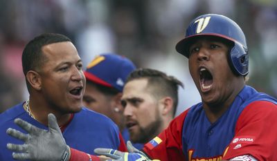 Venezuela's Salvador Perez celebrates after a home-run in the 9th inning during a World Baseball Classic game against Italy, in Guadalajara, Mexico, Saturday, March 11, 2017. All-Star catcher Perez injured his left knee in a home-plate collision with his Kansas City Royals backup Drew Butera in a World Baseball Classic game. Venezuela rallied to beat Italy 11-10 on Martin Prado's 10th-inning double after Butera stumbled into Perez to end the ninth with the score tied at 10.(AP Photo/Luis Gutierrez)