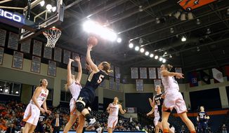 Navy&#39;s Sarita Condie (5) puts up a shot over Bucknell&#39;s Megan McGurk (11) during the first half of an NCAA college basketball Patriot League Championship game in Lewisburg, Pa., Sunday, March 12, 2017. (AP Photo/Chris Knight)