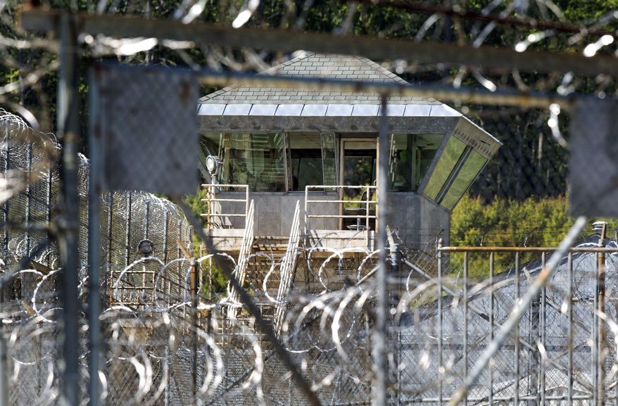 FILE - This June 17, 2016, file photo shows the guard tower at the New Hampshire state prison in Concord, N.H. State lawmakers approved the installation of full-body scanners for the state's prisons, billed as one of the best ways to halt the influx of drugs. But a in March 2017, about a year after approval, machines have yet to be installed in any penitentiaries. (AP Photo/Jim Cole, File)