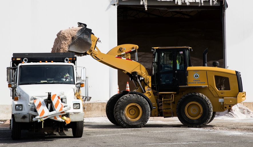 Road crews up and down the East Coast made preparations for a powerful nor&#39;easter on Tuesday. (Associated Press)