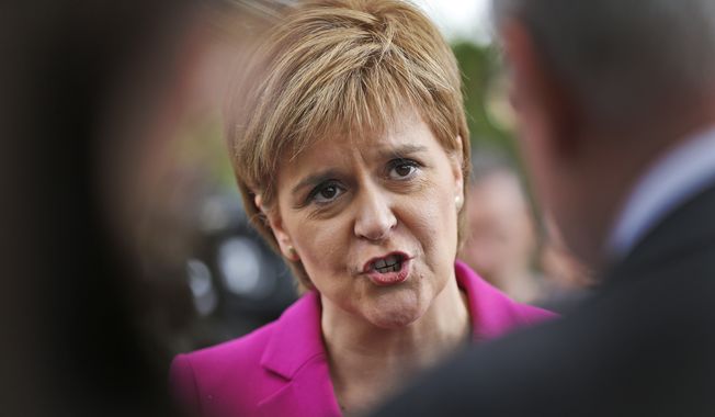 Scottish First Minster Nicola Sturgeon talks to journalists after meeting in London, in this Monday, May 23, 2016, file photo. Scotland&#x27;s leader Nicola Sturgeon will seek authority to hold a new independence referendum in the next two years because Britain is dragging Scotland out of the European Union against its will, she said Monday March 13, 2017. (AP Photo/Frank Augstein, File)