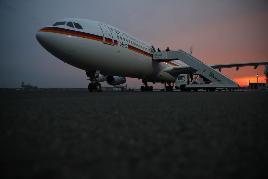 Der Airbus A340 stands at Berlin Tegel airport in Berlin. Monday March 13, 2017. and waits for German chancellor Angela Merkel and her delegation for their flight to the USA to meet with president Donald Trump. (Michael Kappeler/dpa via AP)