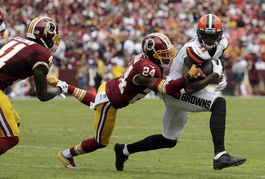 FILE- In this Oct. 2, 2016, file photo, Cleveland Browns wide receiver Terrelle Pryor (11) is tackled by Washington Redskins cornerback Josh Norman (24) during the first half of an NFL football game in Landover, Md. The Redskins signed quarterback-turned-receiver Terrelle Pryor to help fill the void left by the departures of DeSean Jackson and Pierre Garcon. After a battle with Redskins cornerback Josh Norman last season, Pryor gets to show what he can do. (AP Photo/Chuck Burton, File)