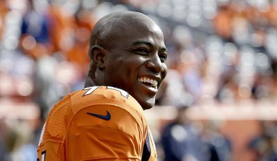 This Oct. 30, 2016 photo shows Denver Broncos outside linebacker DeMarcus Ware (94) smiling prior to an NFL football game against the San Diego Chargers in Denver. Ware won&#x27;t be returning to either the Dallas Cowboys or the Denver Broncos as expected. The 12-year NFL veteran is instead retiring from the NFL. Ware announced his decision Monday, March 13, 2017 on Twitter. (AP Photo/Jack Dempsey, file )