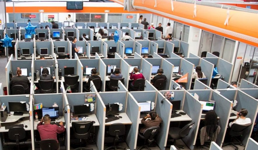 Workers man a call center in the southwestern U.S. (AP file photo)