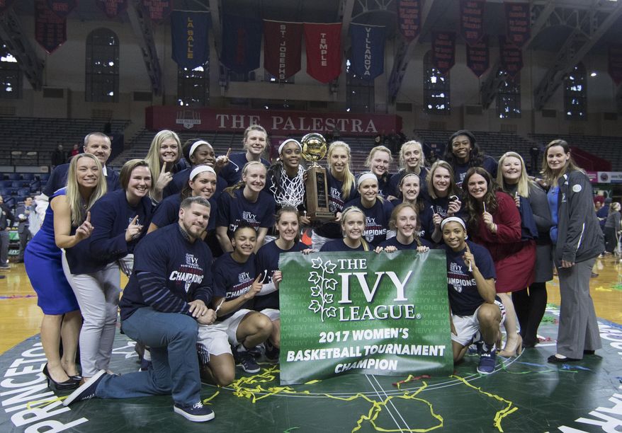 Pennsylvania poses with the Ivy League tournament trophy following an NCAA college basketball championship game against Princeton, Sunday, March 12, 2017, in Philadelphia. Pennsylvania won 57-48. (AP Photo/Chris Szagola)