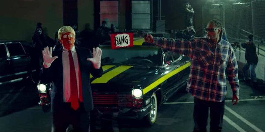 Snoop Dogg shoots a toy gun at a clown dressed as President Trump in a new music video for "Lavender." (Jesse Wellens)