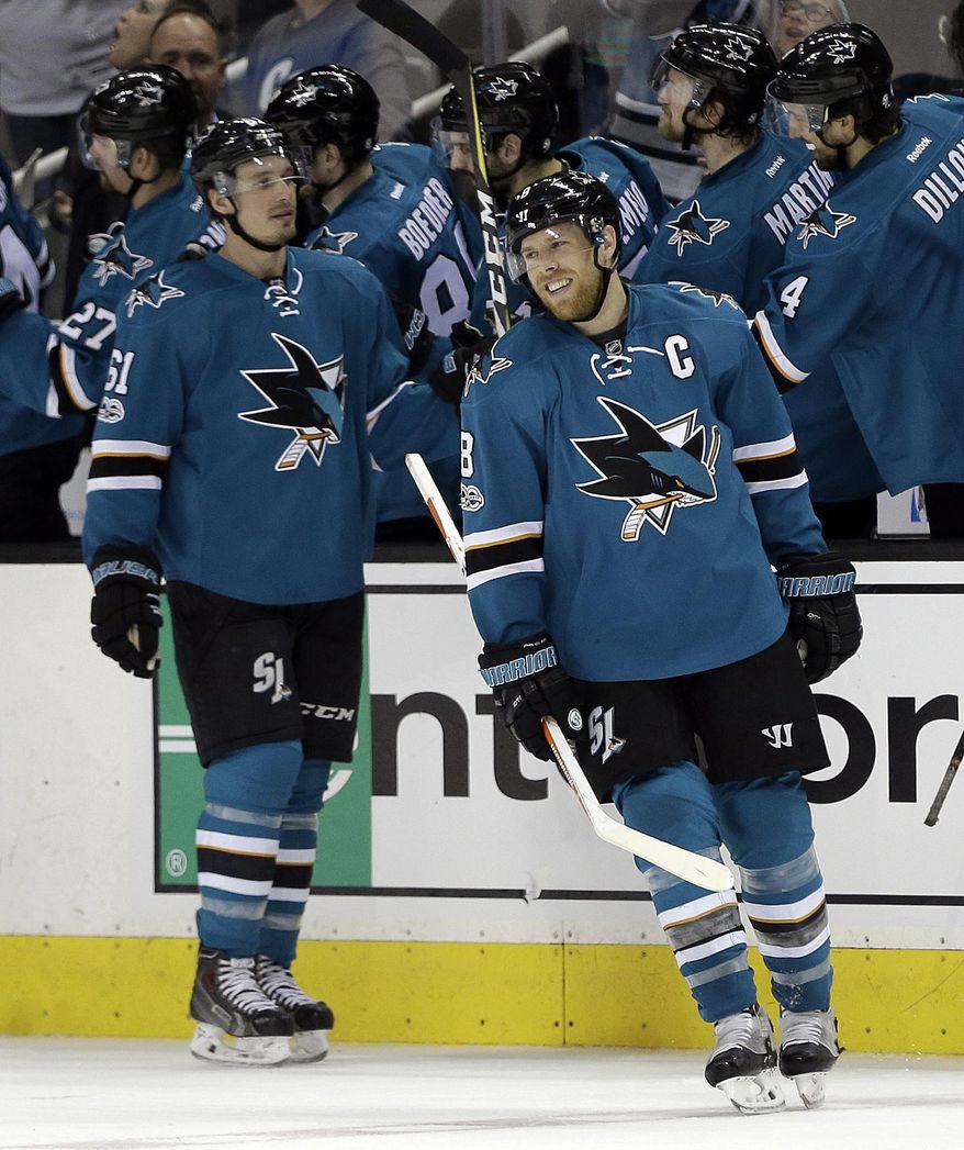 San Jose Sharks&#x27; Joe Pavelski (8) turns from the bench after being congratulated after scoring his second goal against the Dallas Stars during the second period of an NHL hockey game Sunday, March 12, 2017, in San Jose, Calif. (AP Photo/Ben Margot)