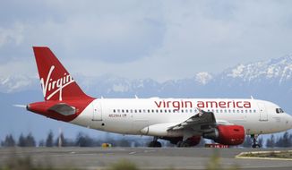 In this Monday, April 4, 2016, file photo, a Virgin America plane taxis before takeoff at Seattle-Tacoma International Airport in Seattle. The government says that U.S. airlines are continuing to post more delays, including dozens of very long ones. In all, 42 flights in January 2017 were stuck on the ground so long that the airlines could be fined. Still, consumer complaints are down. Hawaiian, Delta and American had the best on-time ratings. Virgin America had the worst. (AP Photo/Ted S. Warren, File)