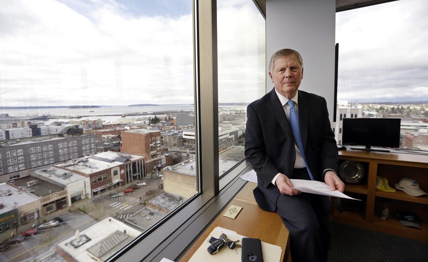 In this Feb. 16, 2017, photo, Everett Mayor Ray Stephanson sits in his corner office overlooking downtown Everett, Wash. Stephanson is suing pharmaceutical giant Purdue Pharma, becoming the first city trying to hold the maker of OxyContin accountable for damages to his community. (AP Photo/Elaine Thompson)