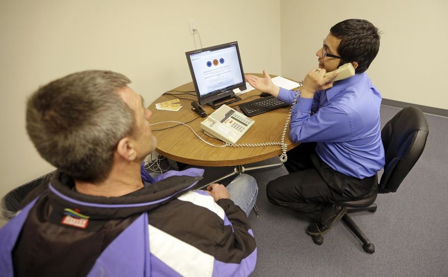 FILE - In this March 31, 2014, file photo, a man, left, looks on as navigator Luis Rios phones in to the hotline while seeking help to buy health insurance at the Utah Health Policy Project, in Salt Lake City. Utah officials are reviewing how the state would be affected by a plan from congressional Republicans to replace President Barack Obama's health care law, but local health advocates say it could make coverage unaffordable for older people and the poor. Gov. Gary Herbert has said the proposal is a "starting point," for a replacement plan, and his office said Tuesday it does not yet know how the proposal would affect Utah's budget. (AP Photo/Rick Bowmer, File)