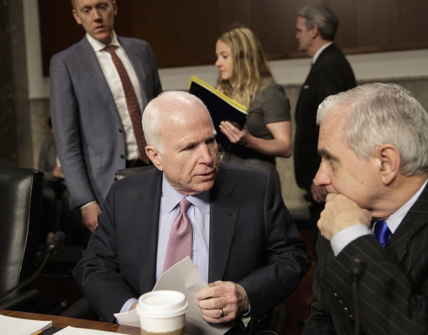Senate Armed Services Committee Chairman Sen. John McCain, R-Ariz., left, confers with the committee's ranking member, Sen. Jack Reed, D-R.I., on Capitol Hill in Washington, Tuesday, March, 14, 2017, prior to the start of the committee's hearing on the investigation of nude photographs of female Marines and other women that were shared on the Facebook page "Marines United." (AP Photo/J. Scott Applewhite)