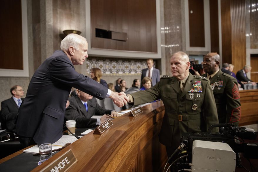 Senate Armed Services Committee Chairman Sen. John McCain, R-Ariz., left, welcomes Marine Corps Commandant Gen. Robert B. Neller, center, and Sgt. Major of the Marine Corps Ronald L. Green on Capitol Hill in Washington, Tuesday, March, 14, 2017, prior to the start of the committee&#39;s hearing on the investigation of nude photographs of female Marines and other women that were shared on the Facebook page &amp;quot;Marines United.&amp;quot;  (AP Photo/J. Scott Applewhite)