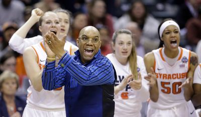 FILE - In this April 3, 2016, file photo, Syracuse head coach Quentin Hillsman cheers during the second half of a national semifinal game against Washington at the women&#39;s Final Four in the NCAA college basketball tournament in Indianapolis. Taking Syracuse to the national championship game last season did not change Orange coach Quentin Hillsman. The Orange lost that title game to Connecticut, and now will open this NCAA Tournament on the Huskies’ home floor this weekend. (AP Photo/Michael Conroy, File)