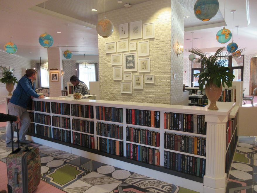 This March 12, 2017 photo shows the lobby of the boutique Graduate hotel in Oxford, Miss. A Graduate hotel is planned for Roosevelt Island in New York for 2019. It will be the island's sole hotel and will be located at the gateway to the new Cornell Tech campus. (AP Photo/Beth J. Harpaz)