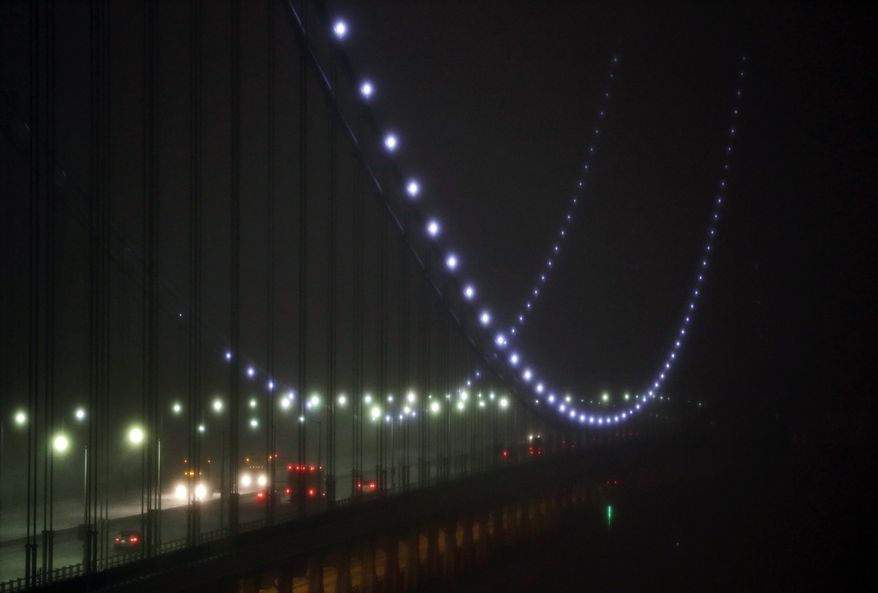 Vehicles move along the George Washington Bridge as snow falls in Fort Lee, N.J., Tuesday, March 14, 2017. Rain, sleet and snow are sweeping across New Jersey as a late-winter storm slows the morning commute. (AP Photo/Seth Wenig)