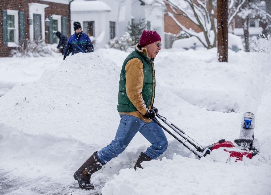 David Watts, Camp Hill, plows his sidewalk and driveway after winter storm Stella dumped over a foot of snow Tuesday, March 14, 2017. The powerful nor’easter grounded nearly 6,000 flights, knocked out power to over 180,000 customers from Virginia northward, closed schools in cities big and small and prompted dire warnings to stay off the roads. Amtrak suspended service and the post office halted mail delivery. (Mark Pynes /PennLive.com via AP)