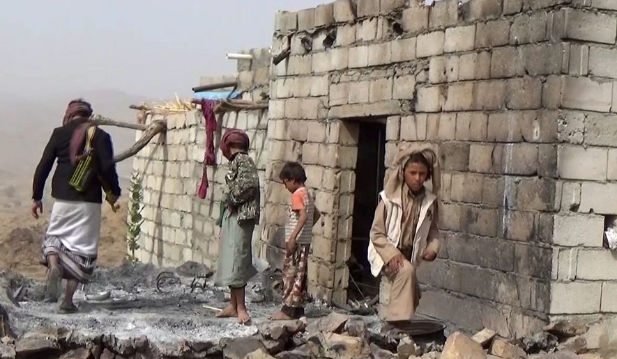 Houses in a tiny Yemeni village were damaged in a January 29 U.S. raid that left at least 25 Yemenis and a U.S. Navy SEAL dead, showing how difficult it is to tell who is al Qaeda in a country where the militants are mingled with tribes and are fighting on the same side as the government against the rebels. (Associated Press)