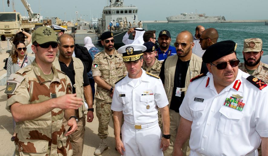 Vice Adm. Kevin Donegan, commander of U.S. Naval Forces Central Command (middle) warned that Iranian-backed Houthi rebels have employed an Iranian-designed remotely piloted small boat filled with explosives to take out enemy targets. He also said Iran supplied the explosives. (U.S. Navy)