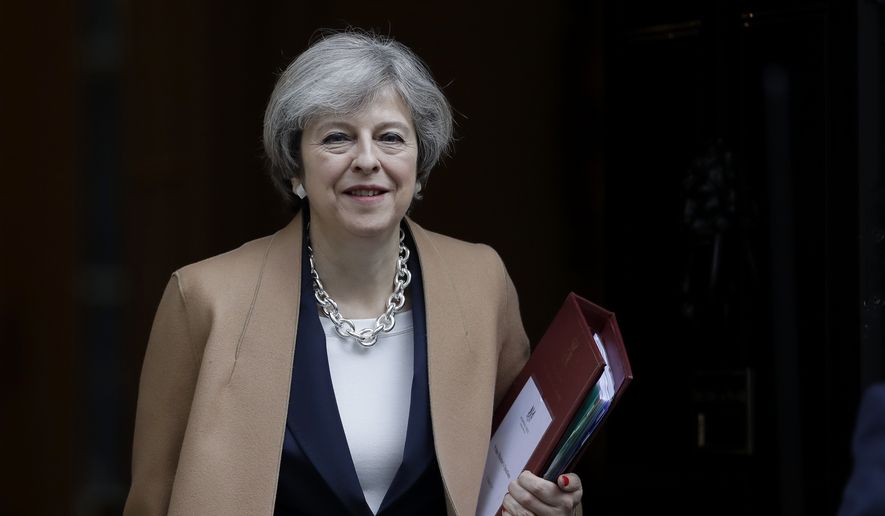 British Prime Minister Theresa May leaves 10 Downing Street in London, to attend Prime Minister's Questions at the Houses of Parliament, Wednesday, March 15, 2017. (AP Photo/Matt Dunham)