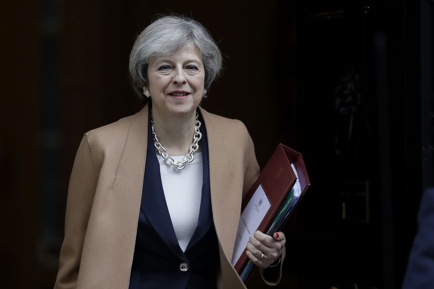 British Prime Minister Theresa May leaves 10 Downing Street in London, to attend Prime Minister's Questions at the Houses of Parliament, Wednesday, March 15, 2017. (AP Photo/Matt Dunham)