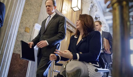 Sen. Pat Toomey, R-Pa., left, and Sen. Tammy Duckworth, D-Ill., arrive at the Senate chamber on Capitol Hill in Washington, Wednesday, March, 15, 2017, for a vote to confirm former Indiana Sen. Dan Coats as director of national intelligence. (AP Photo/J. Scott Applewhite) ** FILE **