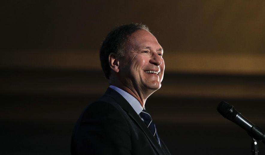FILE- In this Feb. 11, 2017, file photo, Supreme Court Justice Samuel Alito smiles as he delivers a keynote speech at the Claremont Institute&#x27;s annual dinner in Newport Beach, Calif. Alito said Wednesday, March 15, during a speech sponsored by a Catholic organization in New Jersey that the U.S. is entering a period when its commitment to religious liberty is being tested. (AP Photo/Jae C. Hong, File)