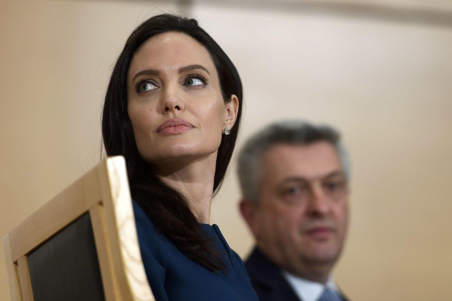 United Nations High Commissioner for Refugees (UNHCR) Goodwill Ambassador American actress Angelina Jolie, left, sits next to United Nations High Commissioner for Refugees, Italian Filippo Grandi, during The annual lecture of the Sergio Vieira de Mello Foundation at the European headquarters of the United Nations in Geneva, Switzerland, Wednesday, March 15, 2017. (Martial Trezzini/Keystone via AP)