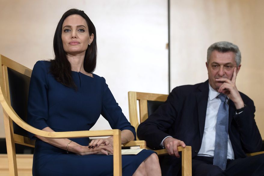 United Nations High Commissioner for Refugees (UNHCR) Goodwill Ambassador American actress Angelina Jolie, left, sits next to United Nations High Commissioner for Refugees, Italian Filippo Grandi, during The annual lecture of the Sergio Vieira de Mello Foundation at the European headquarters of the United Nations in Geneva, Switzerland, Wednesday, March 15, 2017. (Martial Trezzini/Keystone via AP)
