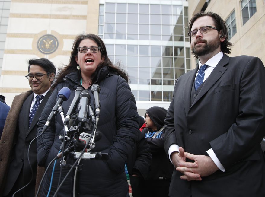 Becca Heller of the International Refugee Assistance Project, center, flanked by Omar Jadwat of the ACLU, left, and Justin Cox of the National Immigration Law Center, representing the plaintiffs, speaks to reporters outside court in Beltsville, Md., Wednesday, March 15, 2017. A federal judge in Maryland says he will issue a ruling in a lawsuit challenging President Donald Trump's revised travel ban. (AP Photo/Manuel Balce Ceneta)