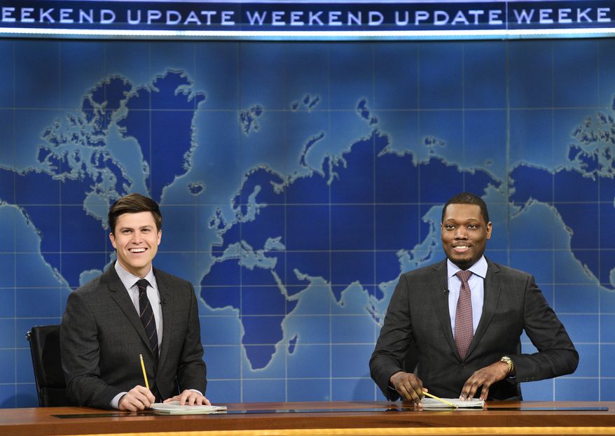 In this March 4, 2017 photo provided by NBC, Colin Jost and Michael Che, right, appear during Weekend Update segment of "Saturday Night Live" in New York. "Saturday Night Live" will broadcast live simultaneously across the U.S. for its final four shows of the season, NBC announced Thursday, March 16. Until now, viewers in the Mountain and Pacific time zones have seen the show not as it aired “live from New York,” but on tape delay. The new live-for-all policy will apply to episodes telecast April 15, May 6, 13 and 20. (Will Heath/NBC via AP)