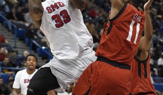 SMU&#39;s Semi Ojeleye shoots as Cincinnati&#39;s Gary Clark, right, defends during the second half of an NCAA college basketball game in the American Athletic Conference tournament final, Sunday, March 12, 2017, in Hartford, Conn. (AP Photo/Jessica Hill)