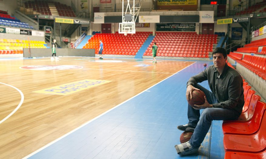 Former Belgian professional basketball player from Brazil, Sebastien Bellin, poses for photographers at the Aalster Basketball Forum in Aalst, Belgium, on Thursday, March 16, 2017. The former basketball player, badly hurt in the suicide bomb attack on Brussels airport a year ago is urging the Belgian government to live up to its pledge to help the victims. (AP Photo/Virginia Mayo)