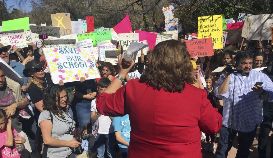 Santa Fe Public Schools Superintendent and former state education secretary Veronica Garcia addresses a rally at the New Mexico state Capitol in Santa Fe, N.M., to urge lawmakers and the governor to bolster spending on K-12 schools for the coming fiscal year, Thursday, March 16, 2017. Garcia canceled classes at mid-day so that staff and students could attend the protest. The state cut public education funding in October and this year swept funding from school district reserves to plug a current-year deficit. (AP Photo/Morgan Lee)