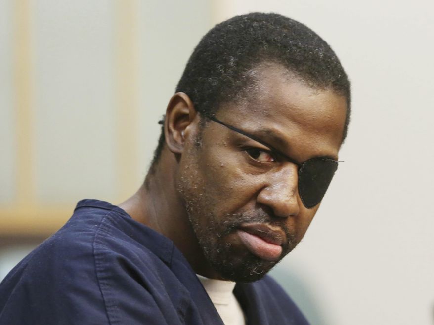 FILE- In this Feb. 22, 2017 file photo, accused murderer Markeith Loyd looks toward family members during court proceedings in Orlando, Fla. State Attorney Aramis Ayala said, Thursday, March 16, 2017, that she had decided to no longer seek the death penalty in first-degree murder cases after conducting a review. The most visible case immediately affected by Ayala's decision is that of Loyd, who is charged with killing his pregnant ex-girlfriend and Orlando Police Lt. Debra Clayton. (Red Huber /Orlando Sentinel via AP, File)