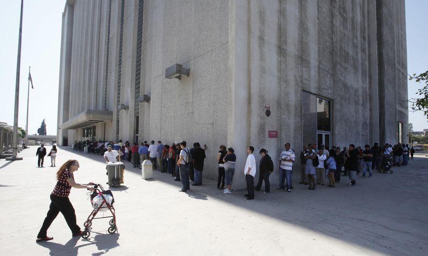 File - In this March 18, 2010, file photo, people line up outside the Metropolitan Courthouse in Los Angeles. The chief justice of the California Supreme Court has asked federal agents to stop making immigration arrests in courthouses to protect residents' access to justice. Chief Justice Tani G. Cantil-Sakauye wrote to top federal officials Thursday, March 16, 2017, that she's concerned that recent reports of immigration agents going to the courts to track down immigrants for arrest will affect the public's trust in the court system. (AP Photo/Damian Dovarganes, File)