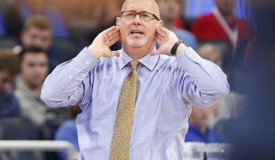 East Tennessee State head coach Steve Forbes calls out a play during the first half of a first-round men&#x27;s college basketball game against Florida in the NCAA Tournament, Thursday, March 16, 2017,  in Orlando, Fla. (AP Photo/Wilfredo Lee)