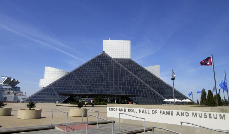 FILE – This April 24, 2016, file photo shows the Rock and Roll Hall of Fame and Museum, located on the shores of Lake Erie in downtown Cleveland. The Rock and Roll Hall of Fame will celebrate 50 years of Rolling Stone magazine in a new exhibit set to open this spring in Cleveland. Highlights of cover images reaching back to rock 'n' roll pioneers such as Elvis Presley and Chuck Berry also will be included in the exhibit that opens May 5, 2017. (AP Photo/Beth J. Harpaz, File)