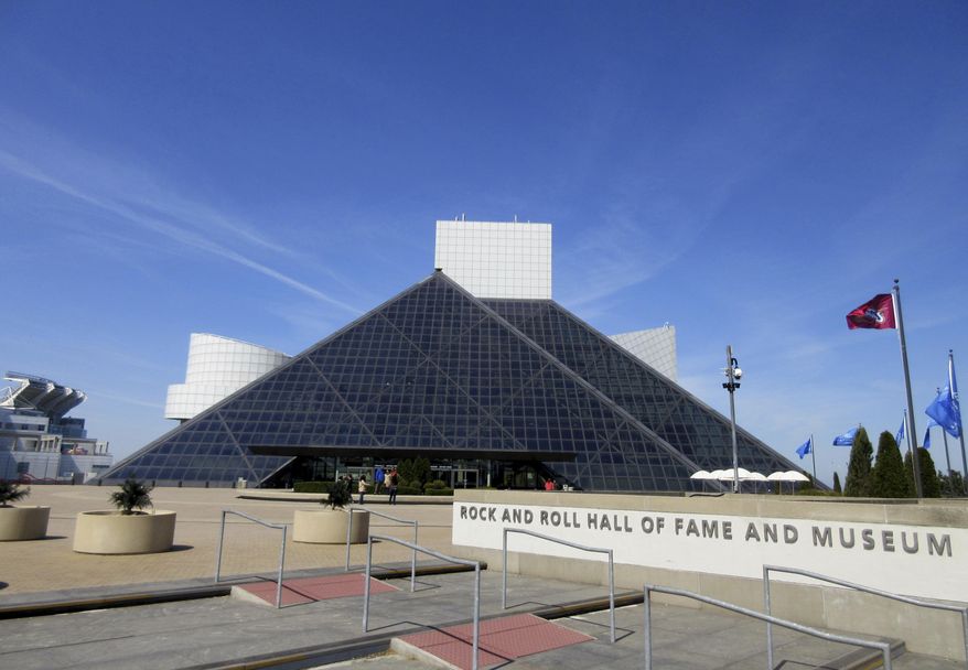 FILE – This April 24, 2016, file photo shows the Rock and Roll Hall of Fame and Museum, located on the shores of Lake Erie in downtown Cleveland. The Rock and Roll Hall of Fame will celebrate 50 years of Rolling Stone magazine in a new exhibit set to open this spring in Cleveland. Highlights of cover images reaching back to rock 'n' roll pioneers such as Elvis Presley and Chuck Berry also will be included in the exhibit that opens May 5, 2017. (AP Photo/Beth J. Harpaz, File)