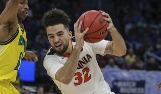 Virginia guard London Perrantes (32) drives to the basket during the second half of the first round of the NCAA college basketball tournament, Thursday, March 16, 2017 in Orlando, Fla. (AP Photo/Gary McCullough) **FILE**