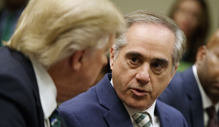 Veteran Affairs Secretary David Shulkin speaks to President Donald Trump during a meeting about veterans affairs, Friday, March 17, 2017, in the Roosevelt Room of the White House in Washington. (AP Photo/Evan Vucci) ** FILE **