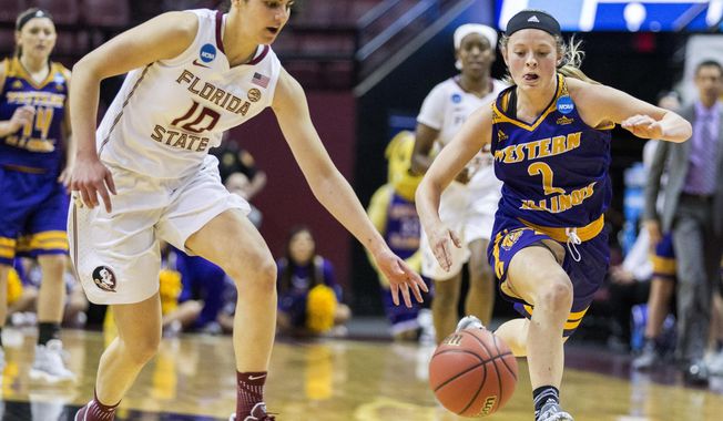 Florida State guard Leticia Romero and Western Illinois guard Emily Clemens race for a loose ball  during the first half of a first-round game in the NCAA women's college basketball tournament in Tallahassee, Fla., Friday March 17, 2017. (AP Photo/Mark Wallheiser)