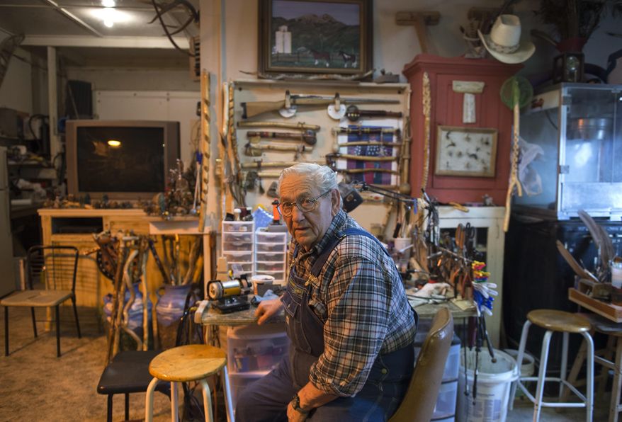 In this Feb. 22, 2017 photo, DelRoy Mitton, a prankster, poses in his shop on Oakley's Main Street in Idaho. Milton lives, works and plays tricks on his visitors in a remodeled hotel on Oakley's Main Street. (Drew Nash/The Times-News via AP)