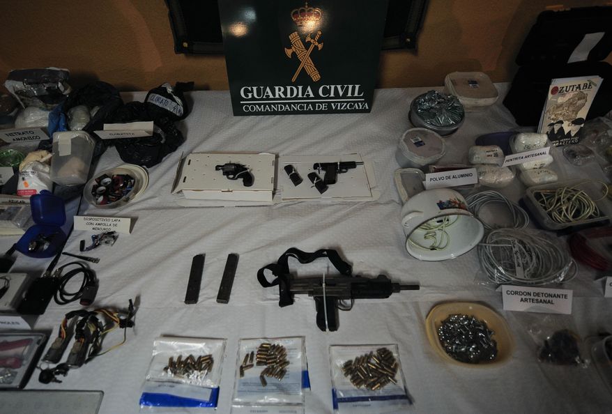 FILE - In this March 1, 2011 file photo, a display of munitions, weapons and 200 kilograms of explosives captured from the Basque separatist group ETA by the Civil Guard are displayed in Bilbao, northern Spain. Spanish media are reporting that ETA are set to announce Friday March 17, 2017 its new initiative to lay down weapons aimed at speeding the stalled process of disbanding. (AP Photo/Alvaro Barrientos, File)