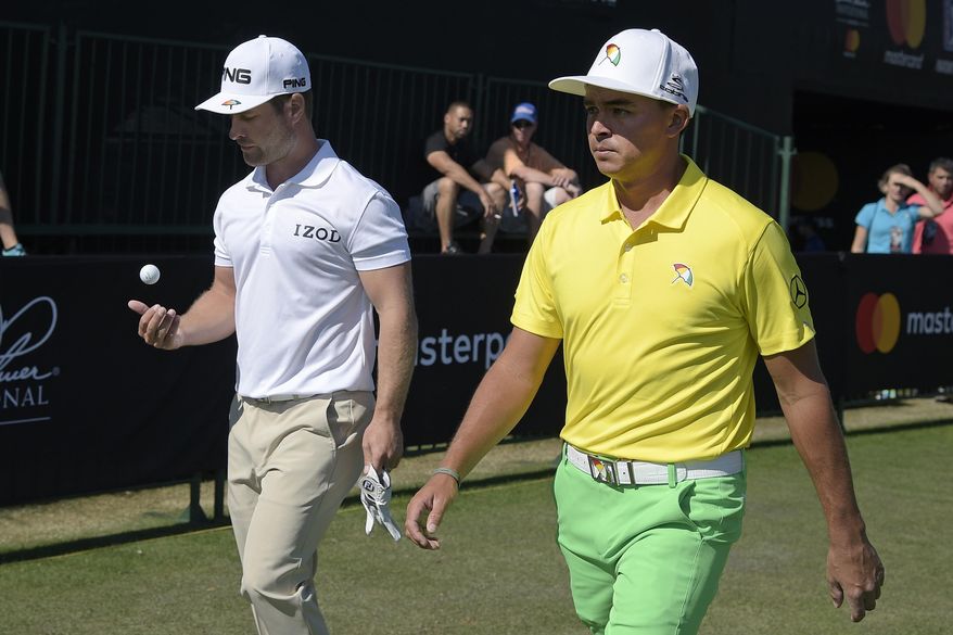 David Lingmerth, left, of Sweden, and Rickie Fowler walk to the 10th tee after making their putts on the ninth green during the third round of the Arnold Palmer Invitational golf tournament in Orlando, Fla., Saturday, March 18, 2017. (AP Photo/Phelan M. Ebenhack)